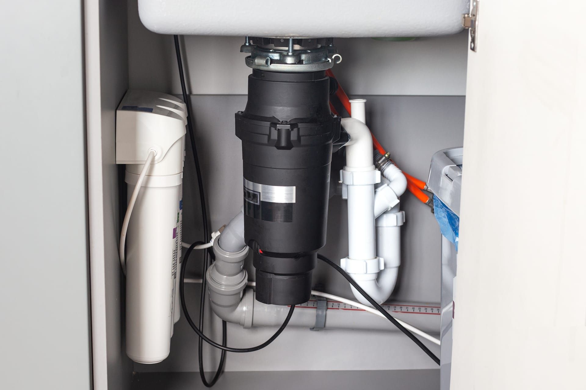 Garbage disposal unit installed under a kitchen sink